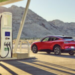A Ford Mustang Mach-E at an Electrify America fast-charging station.