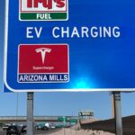 The first highway sign with Superchargers: Exit 155 off Interstate 10 — Arizona Mills in Tempe, Arizona. Tesla highway sign (source: Tesla)